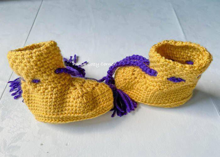 Bright Yellow Crochet Baby Booties with Purple Accents