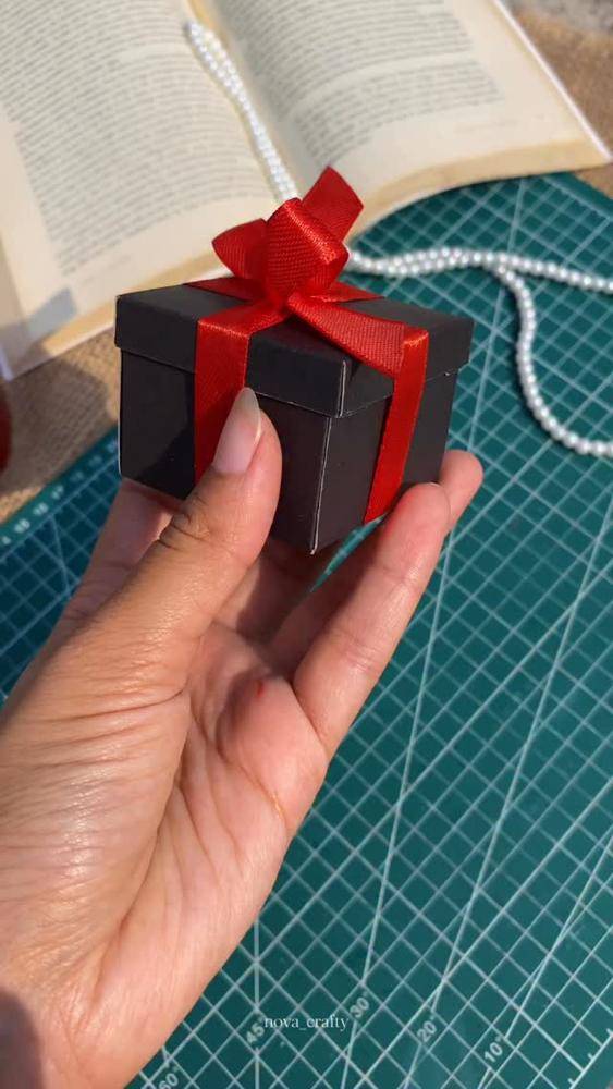Elegant Black Gift Box with Red Ribbon