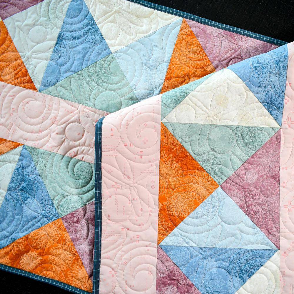 Geometric Patchwork Quilt with Floral Accents