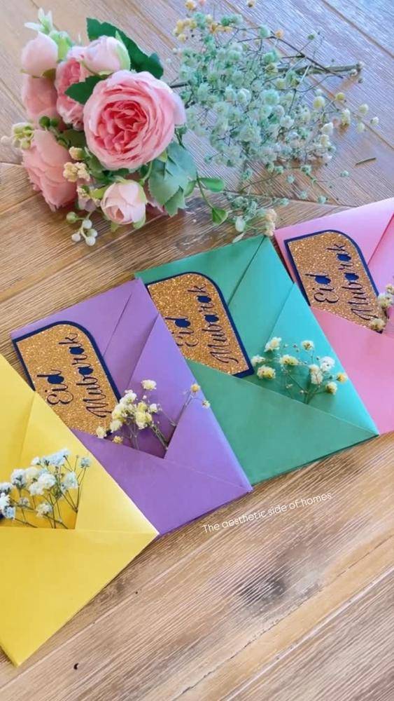 Vibrant Folded Paper Envelopes with Glitter Accents
